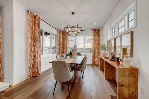 The designated dining space is ideal meal time or when hosting a large group for a sit down meal. (model photo)