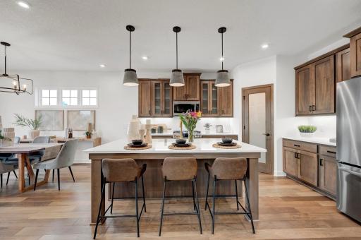 The kitchen has beautiful features throughout and has great functionality such as the walk in pantry. (model photo)