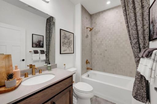 The lower level bath is stunning and spacious. (model photo)