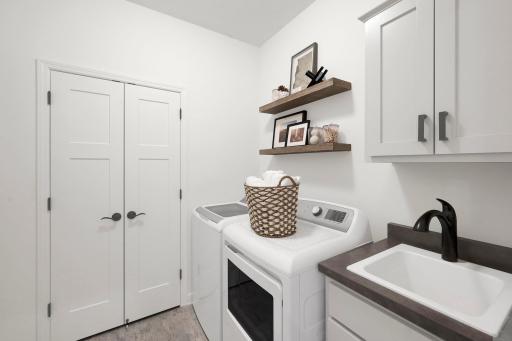 Main level laundry is essential with main level living. (model photo)