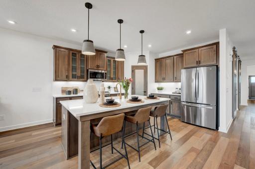 The kitchen is a centerpiece of the home and is perfect for the gourmet chef or the entertainer! (model photo)