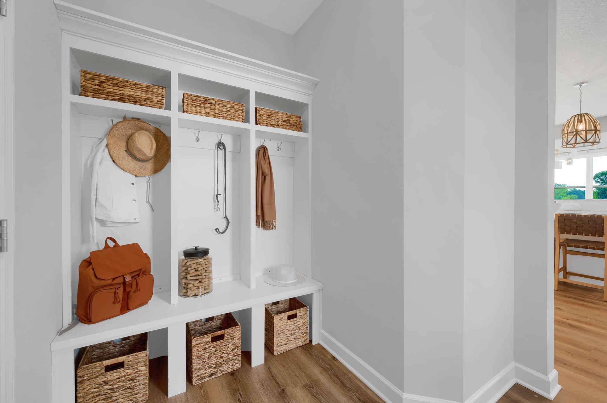 The mudroom is perfect for built in cubbies, hooks and benches. An ideal location to keep seasonal gear organized. (model photo)