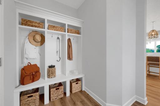 The mudroom is perfect for built in cubbies, hooks and benches. An ideal location to keep seasonal gear organized. (model photo)