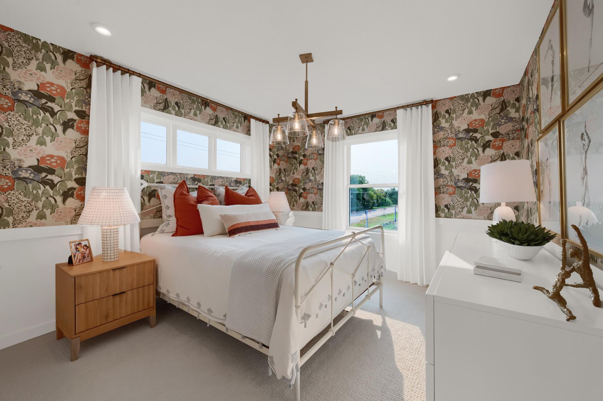 The upper level bedrooms feature large windows for natural night and perfect sized closets for storage. (model photo)