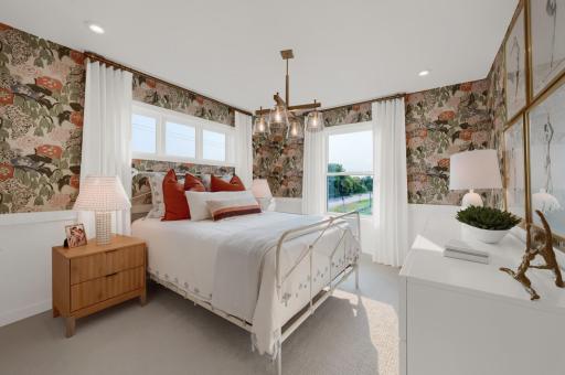 The upper level bedrooms feature large windows for natural night and perfect sized closets for storage. (model photo)