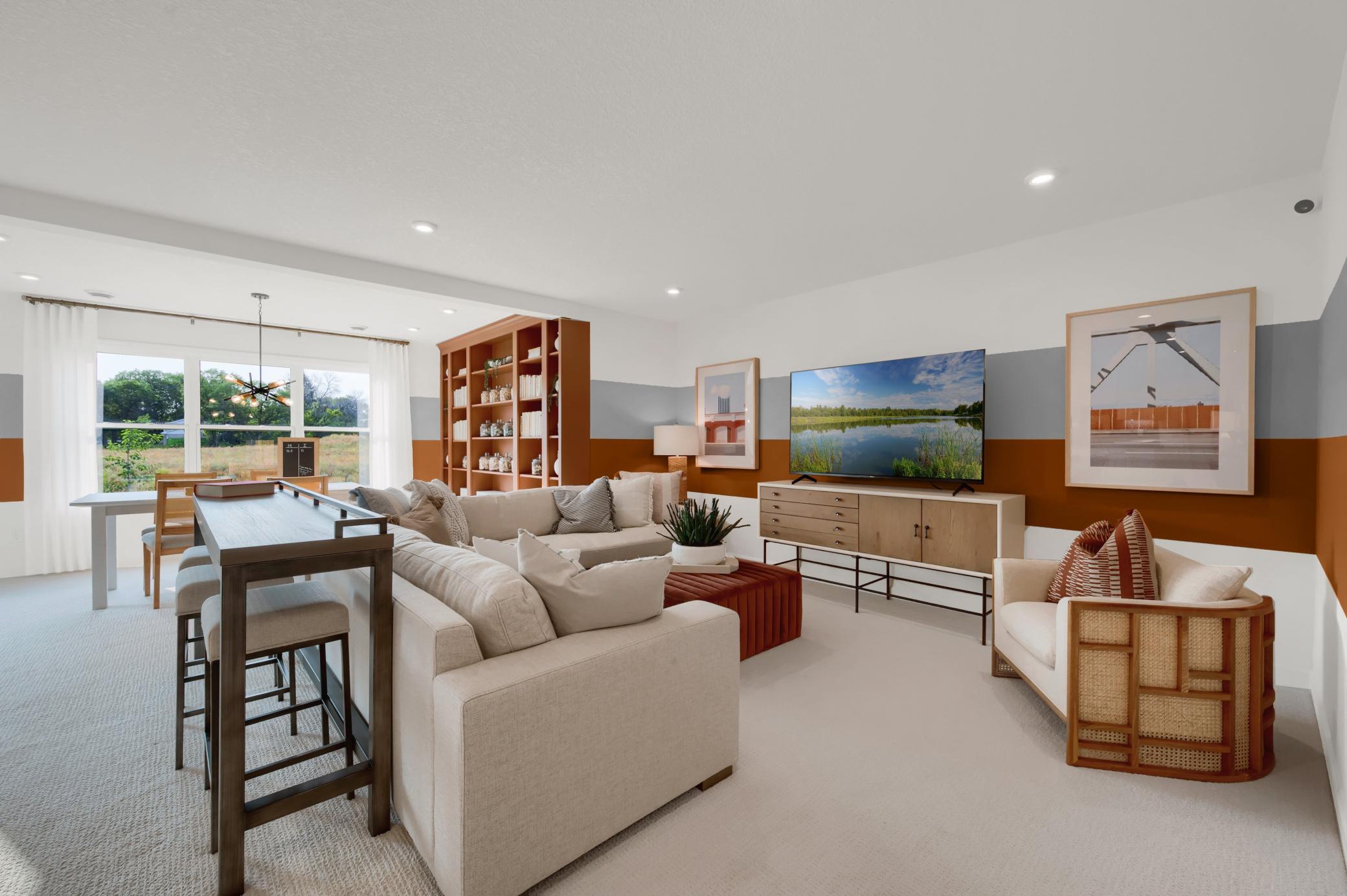 Another view of the finished lower level, the morning room space continues in the lower level which makes a spacious basement have even more wow factor! (model photo)