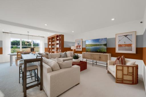 Another view of the finished lower level, the morning room space continues in the lower level which makes a spacious basement have even more wow factor! (model photo)
