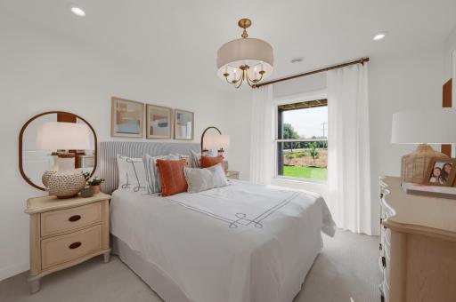 Need a space for guests? This home features another perfectly sized bedroom located in the finished lower level. (model photo)