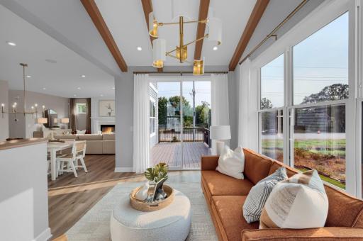 The morning room adds to the open spaces of the lower level and provides more large windows to allow light to flood the lower level of the home. (model photo)