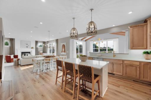 The kitchen is anchored by a large quartz kitchen island. (model photo)