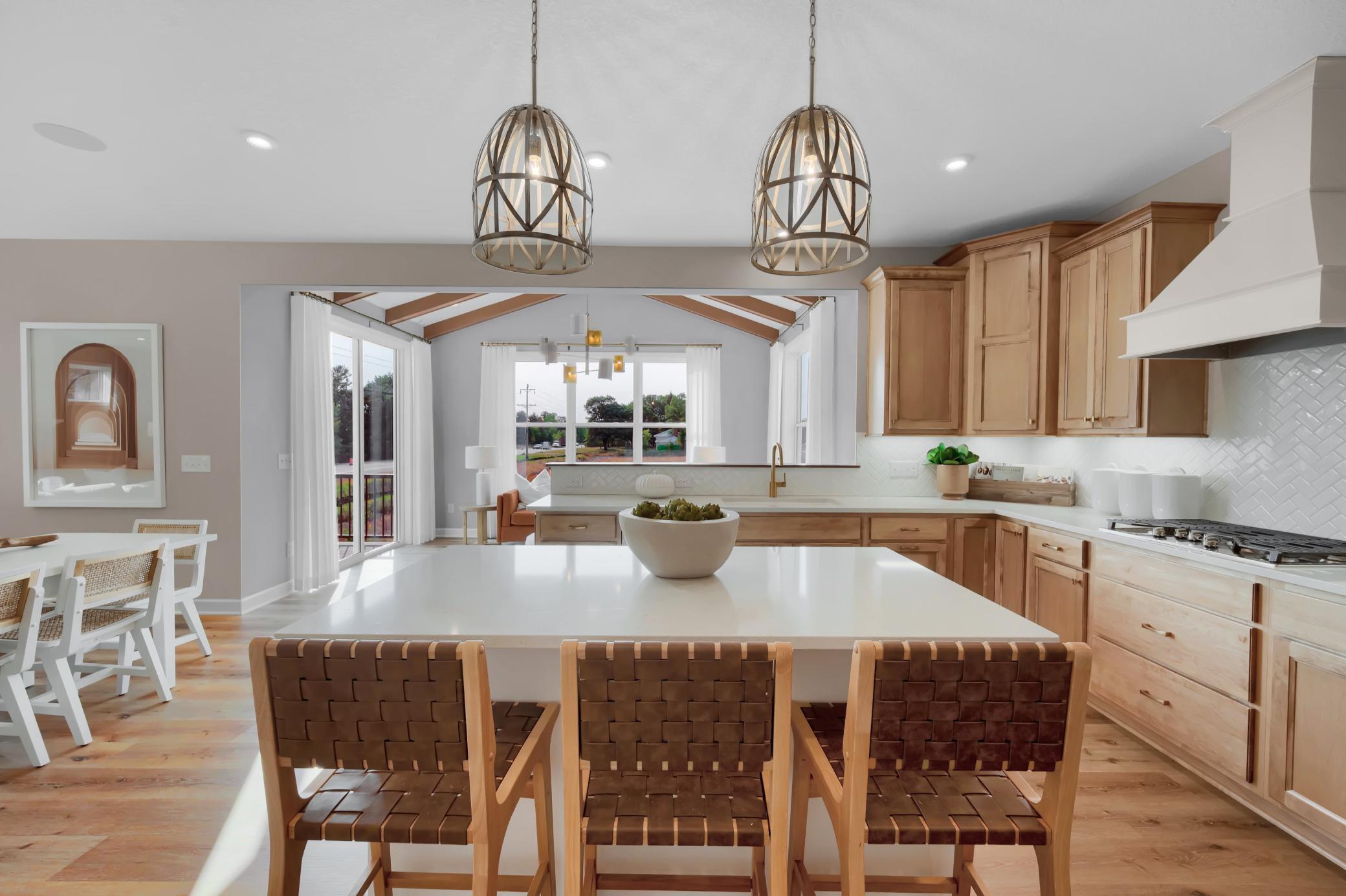 The kitchen flows seamlessly to the dining and morning room. (model photo)