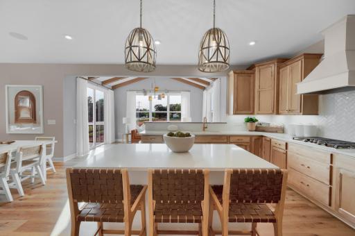 The kitchen flows seamlessly to the dining and morning room. (model photo)