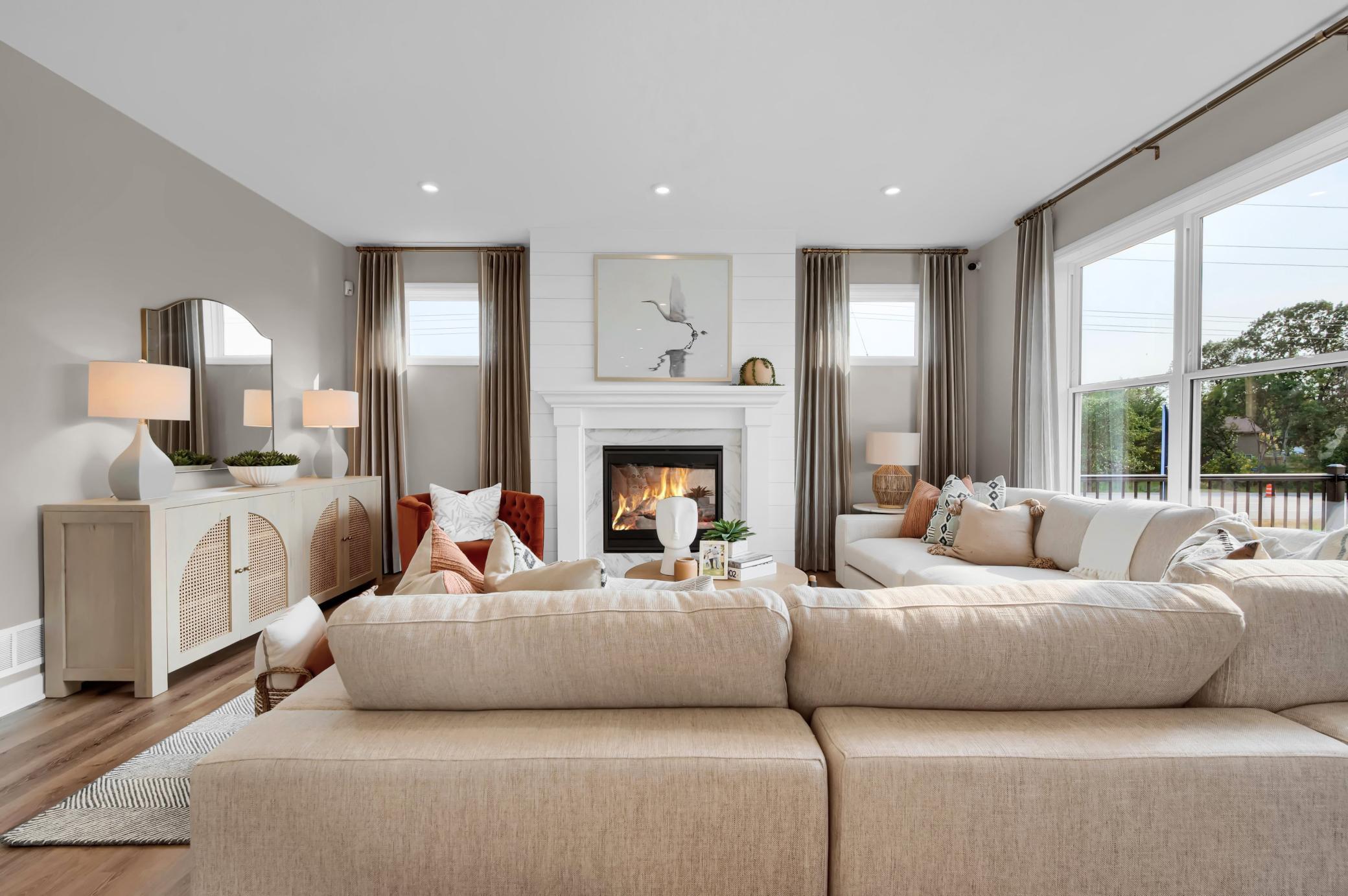 The family room has a number of large windows adding to the natural light of the main level. (model photo)