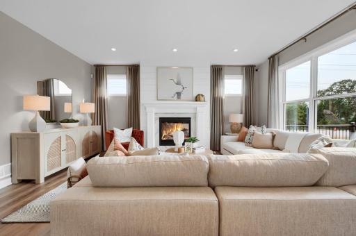 The family room has a number of large windows adding to the natural light of the main level. (model photo)
