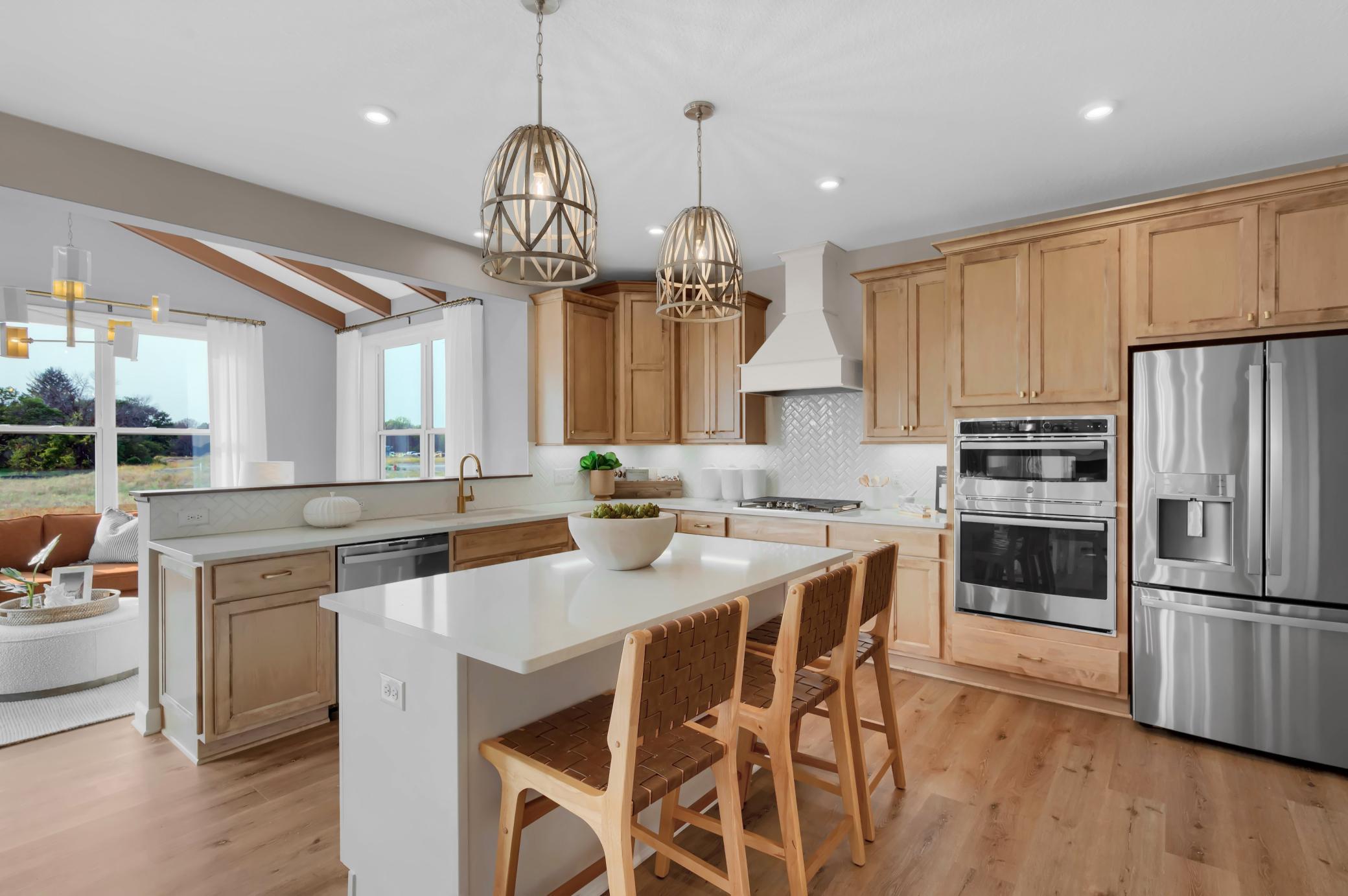 The kitchen is such a gathering place for todays households and this home delivers as the ideal place to host family and guests alike. (model photo)
