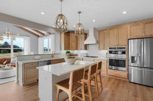 The kitchen is such a gathering place for todays households and this home delivers as the ideal place to host family and guests alike. (model photo)