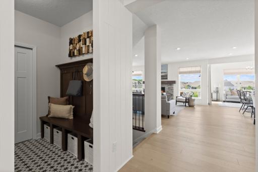 Spacious mudroom with ample storage solutions, ideal for busy households and seamless dat to day organization. (model photo)