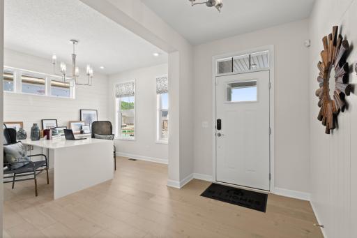 Thoughtfully designed foyer showcasing modern finishes, durable flooring, and a layout that seamlessly connects to the main living areas. (model photo)