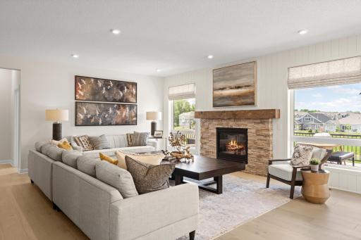 The family room is spacious and has large windows to allow natural light to pour into the home. (model photo)