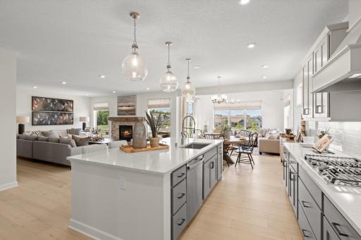 Hosts view of the kitchen, great room, morning room and dinning room. (model photo)