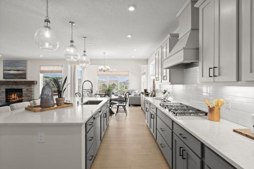 The main floor is perfectly designed to be interactive and provide an abundance of natural light. (model photo)