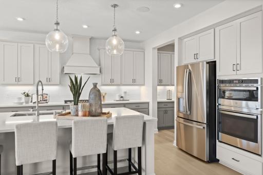 The kitchen flows seamlessly into the butler's pantry, a convenient place for added kitchen organization and meal prep. (model photo)