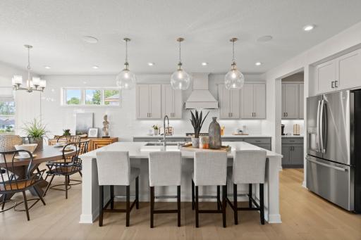The spacious gourmet kitchen is the centerpiece of this home. Perfect for the gourmet chef or the entertainer! (model photo)