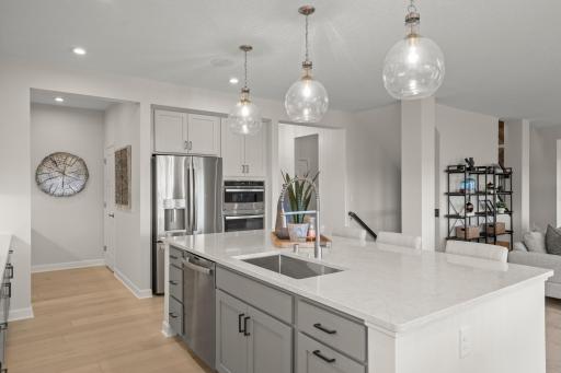 The large center island provides true eat in capabilities to go along with handy storage. (model photo)