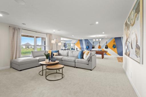 If you are typically the host for holiday get togethers? You can continue that tradition as this home features this huge lower level rec room. (model photo)