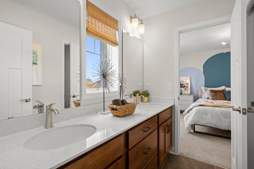 Clean and well appointed bathrooms within the home are designed for both style and convenience. (model photo)