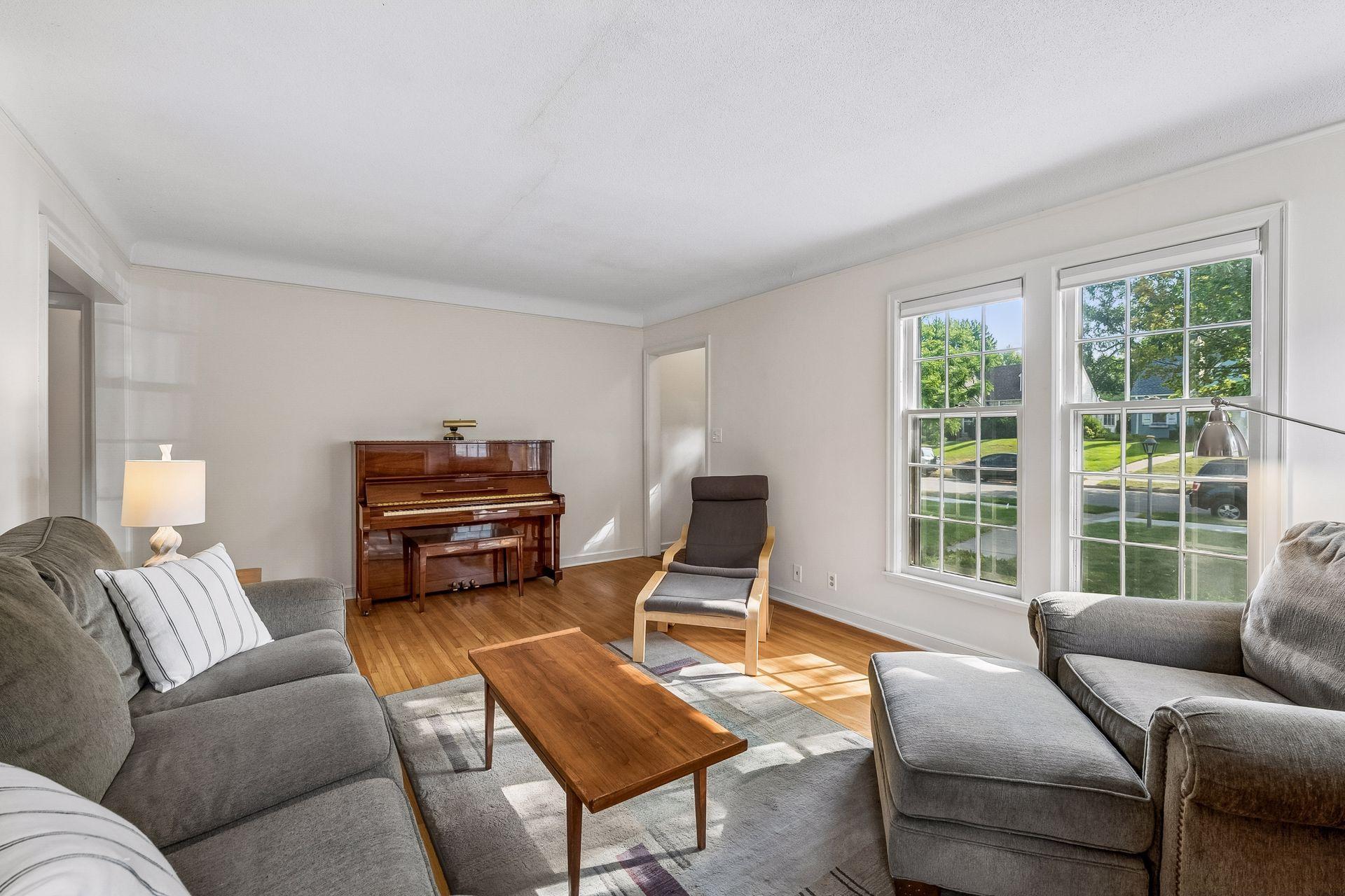 Crown molding. Double living room windows.