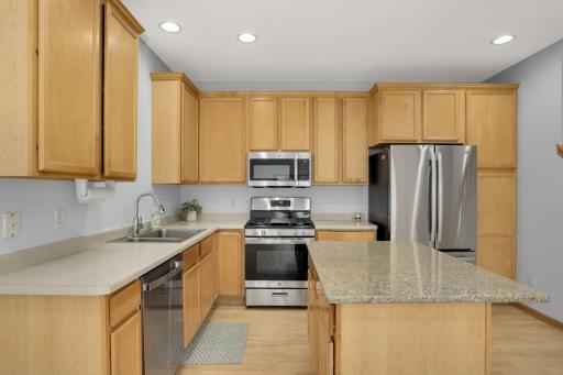 Great cabinet space and center island with bar counter