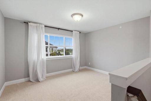 Flexible upper-level loft, perfect for an office or playroom