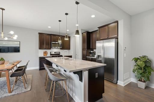 Gourmet kitchen with large center island - virtually staged