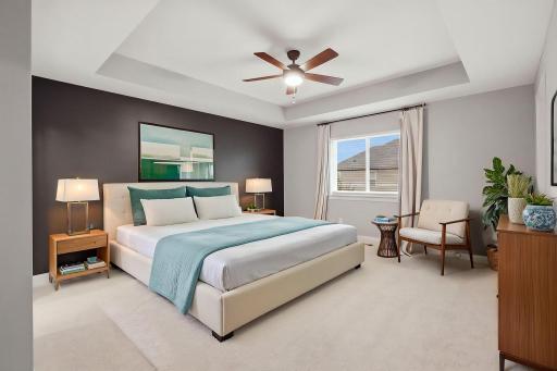Primary suite with tray ceiling virtually staged.jpeg