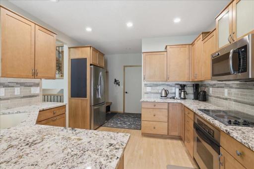 Elevated, spacious kitchen. Maple - wood floors.