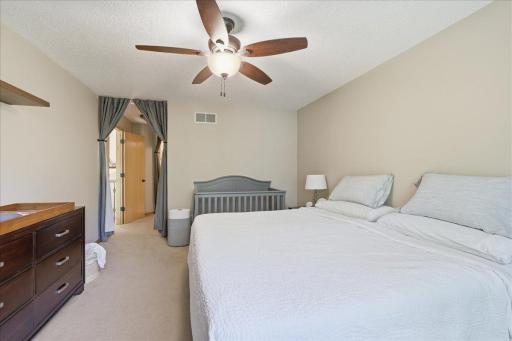 Primary Suite boasts: privacy, tree-top, magical woods garden and lake views, mini private hallway to bath/walk in closet. Separate oversized tub and shower, dual sinks, water closet, walk-in closet.