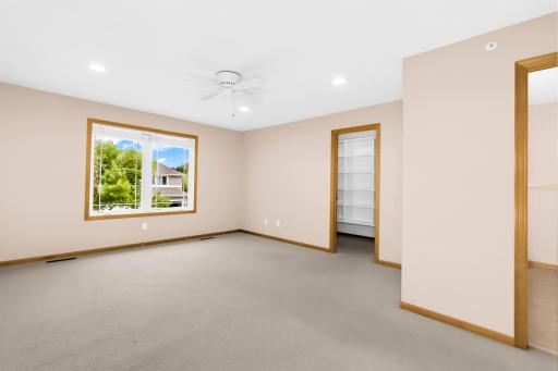 Massive primary bedroom with custom built ins in the walk in closet