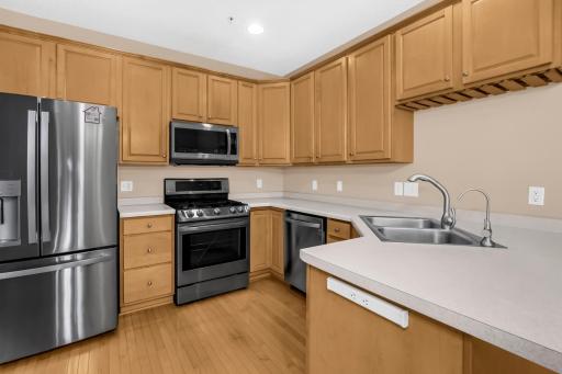 All SS appliances in the kitchen with plenty of cabinets.