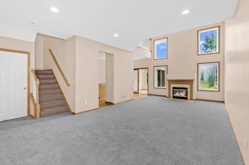 Walk in to the massive living room with soaring 20 foot ceilings!
