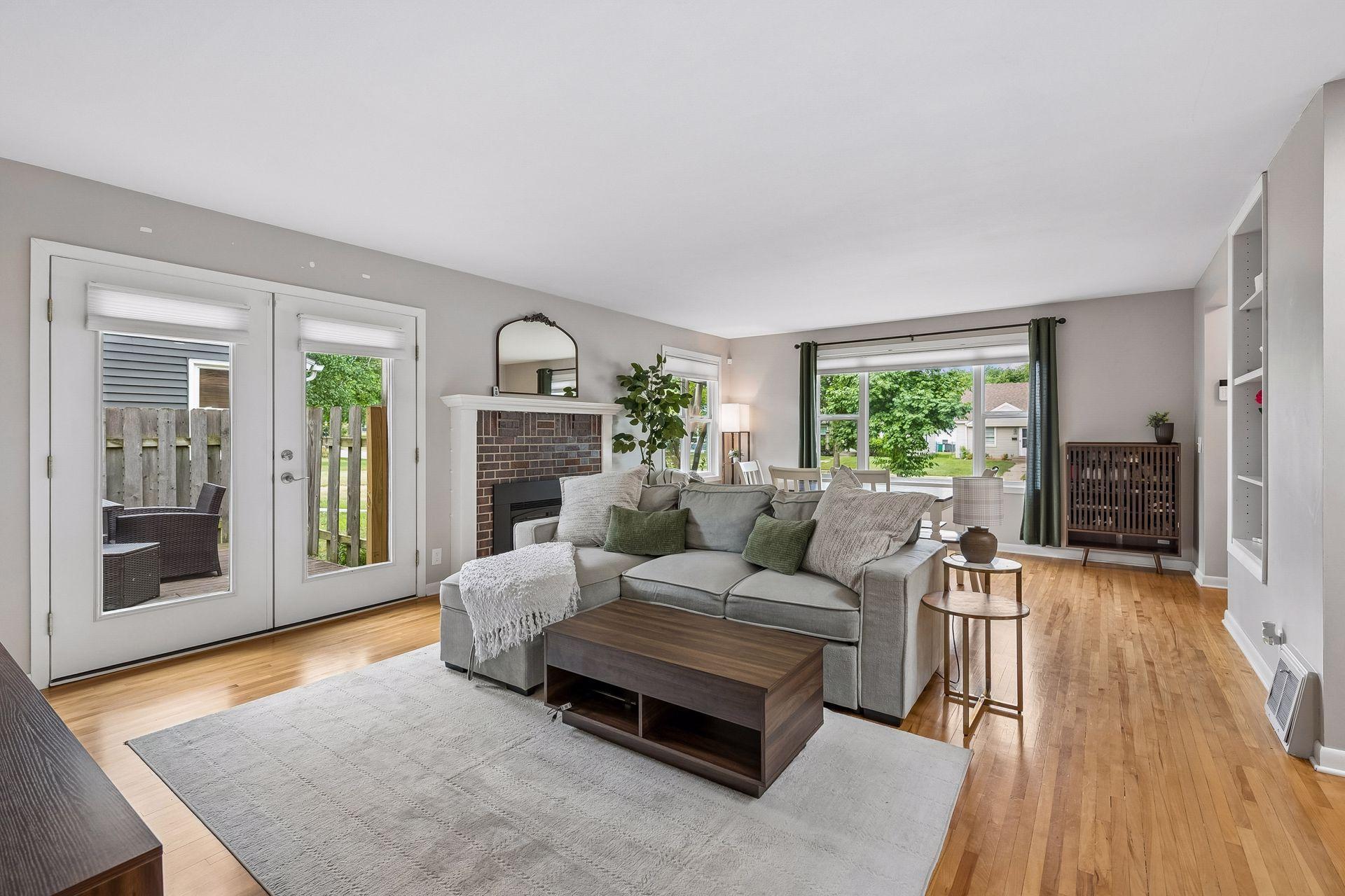 Open Floor Plan with Light and French Doors to Deck and Backyard.