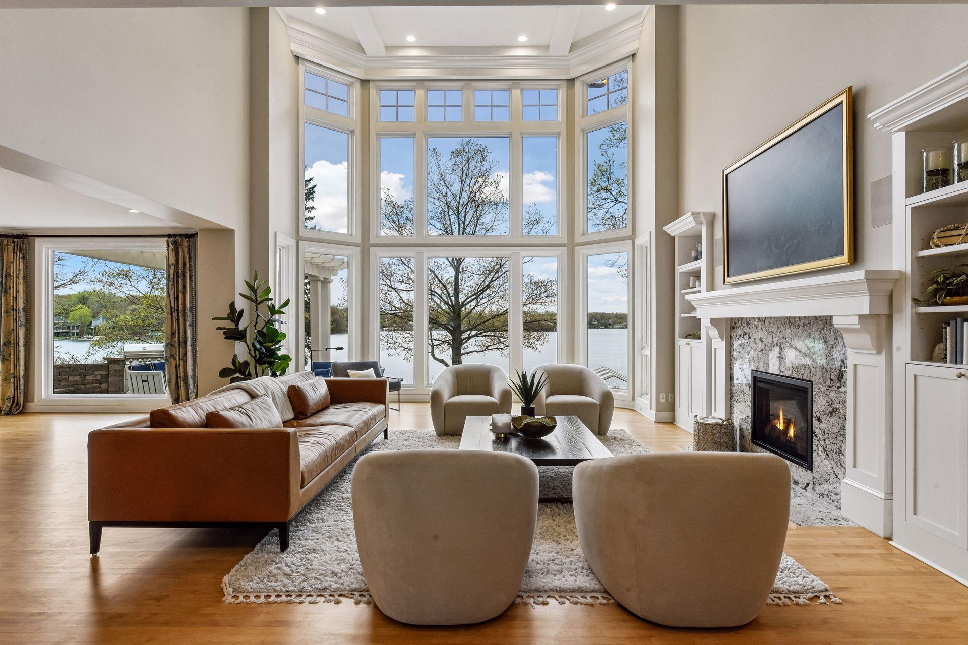 This East Coast-inspired home offers a bright, open layout with floor-to-ceiling windows and south-facing lake views.
