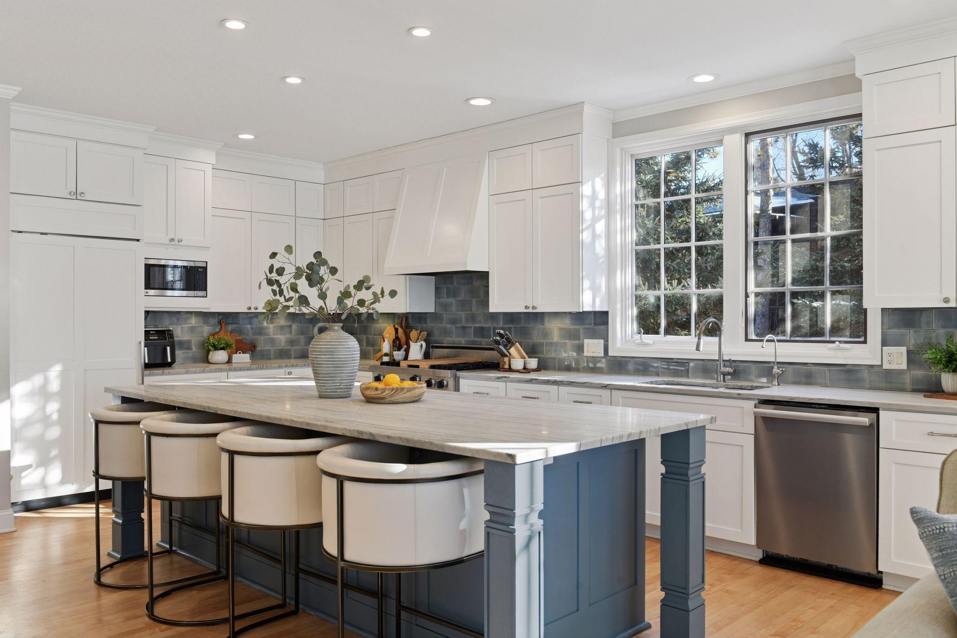 Entertain family and friends in the gourmet kitchen with high-end appliances, designer tile backsplash, and gorgeous countertops.