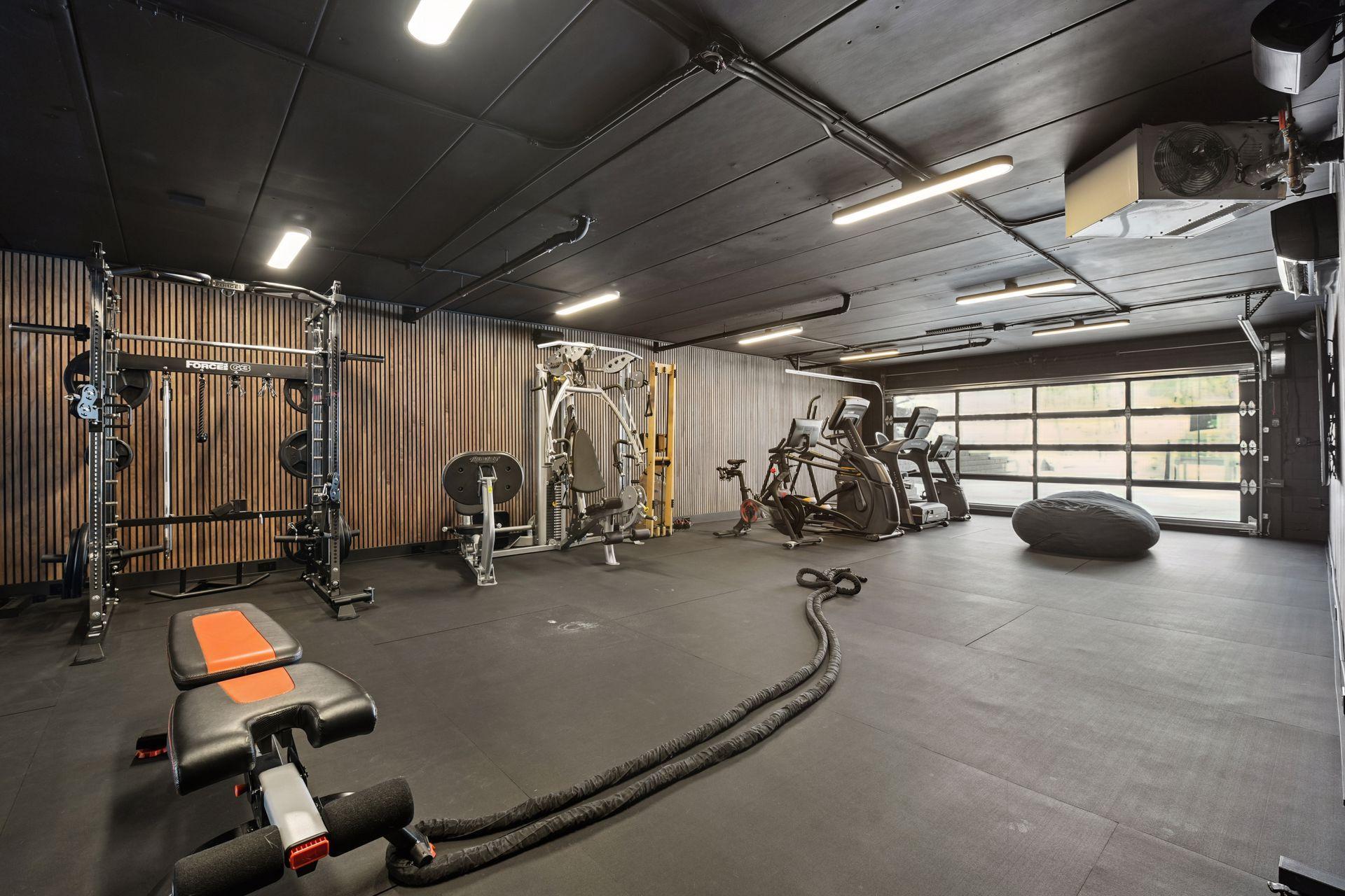 The most impressive addition to this home is a CrossFit-style gym with a new garage door, rubber gym flooring, finished walls, vapor and humidity protection, dedicated air conditioning and heat, and state-of-the-art audio-visual equipment.