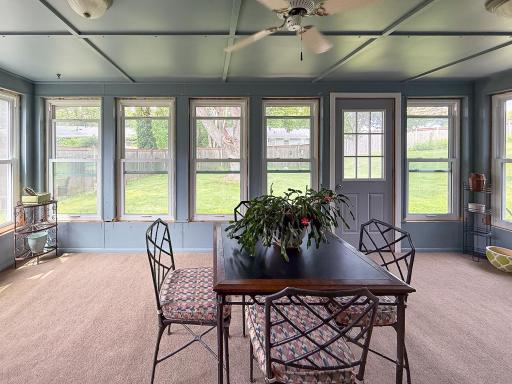 Porch has all new windows and a ceiling fan