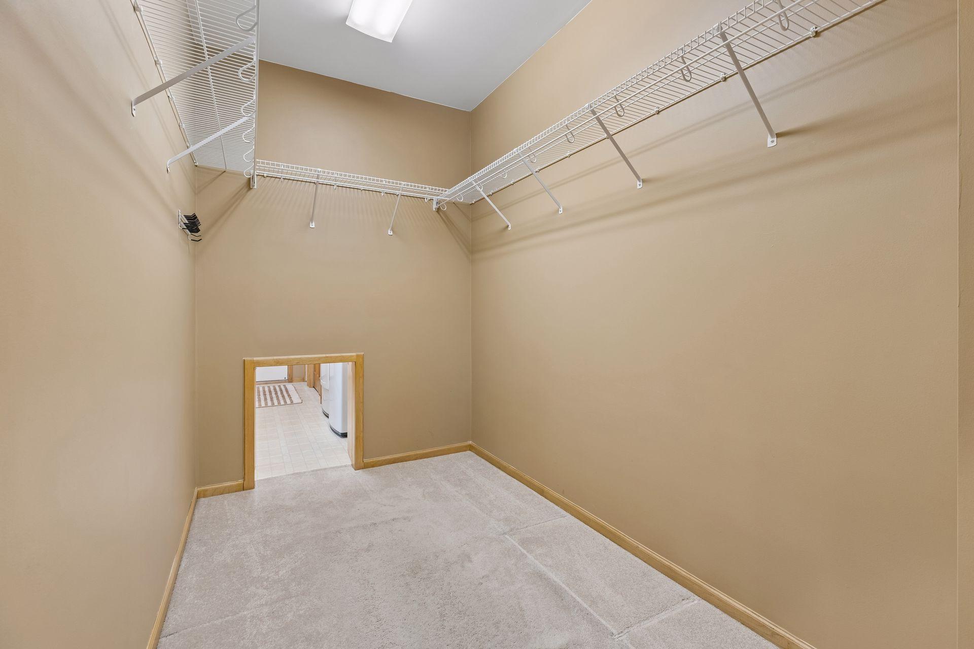 Laundry Pass Through in Primary Bedroom Closet