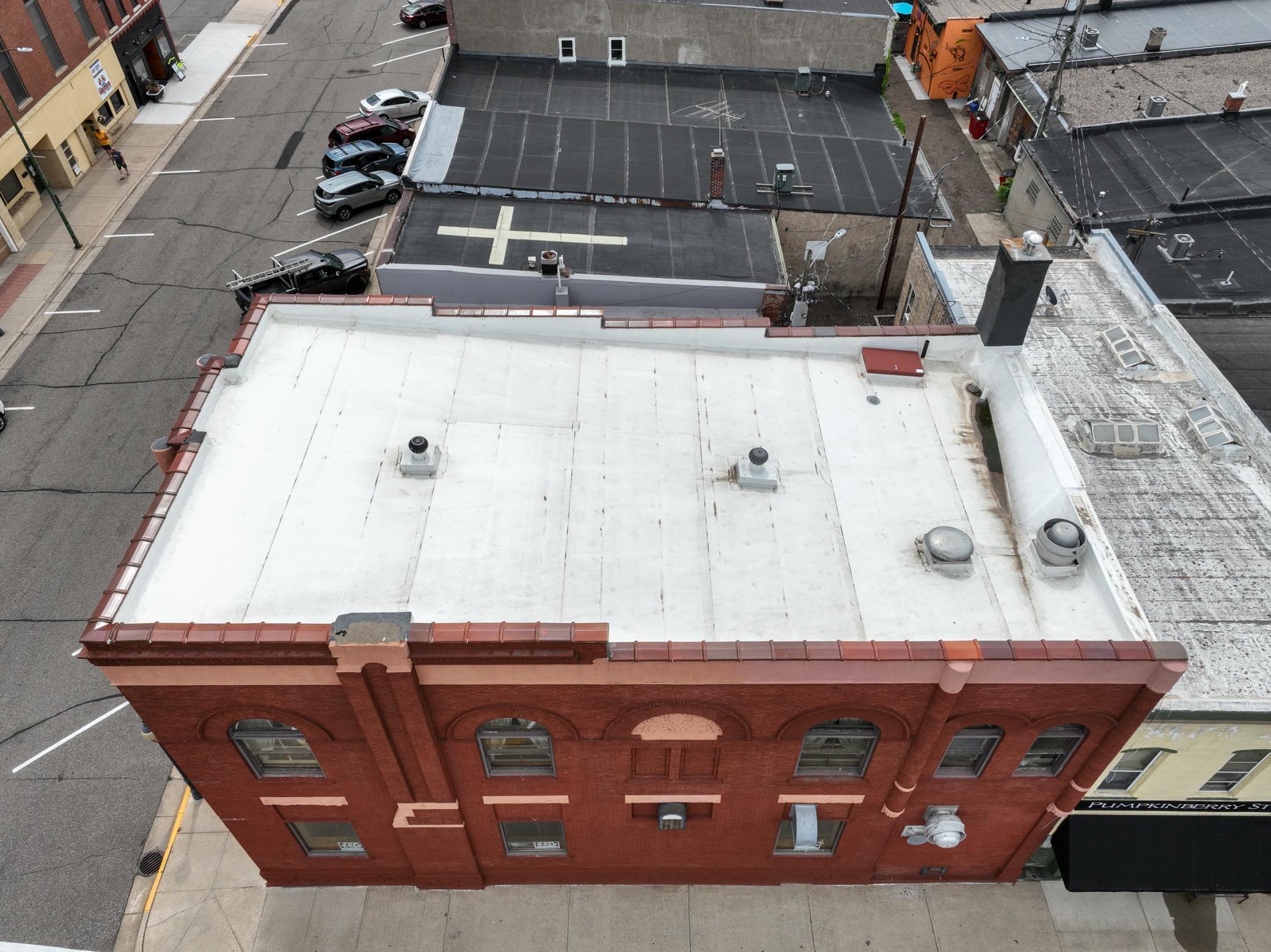 Aerial view of new roof and new parapet wall in 2023