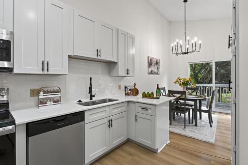 Main level: kitchen with all new cabinets, quartz counters, backsplash, stainless appliances