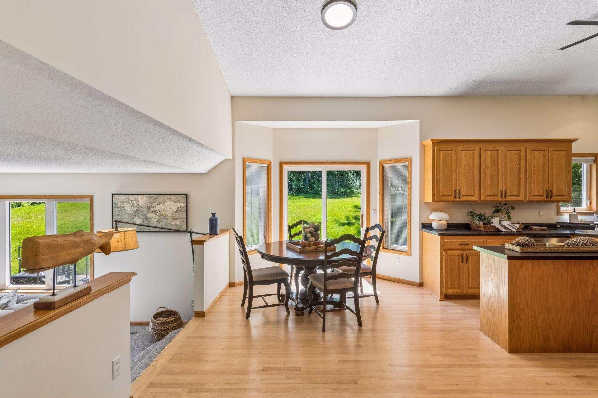 Perfectly positioned between the kitchen and family room, the informal dining area is filled with natural light and features a sliding glass door that opens to the backyard and expansive stamped concrete patio.
