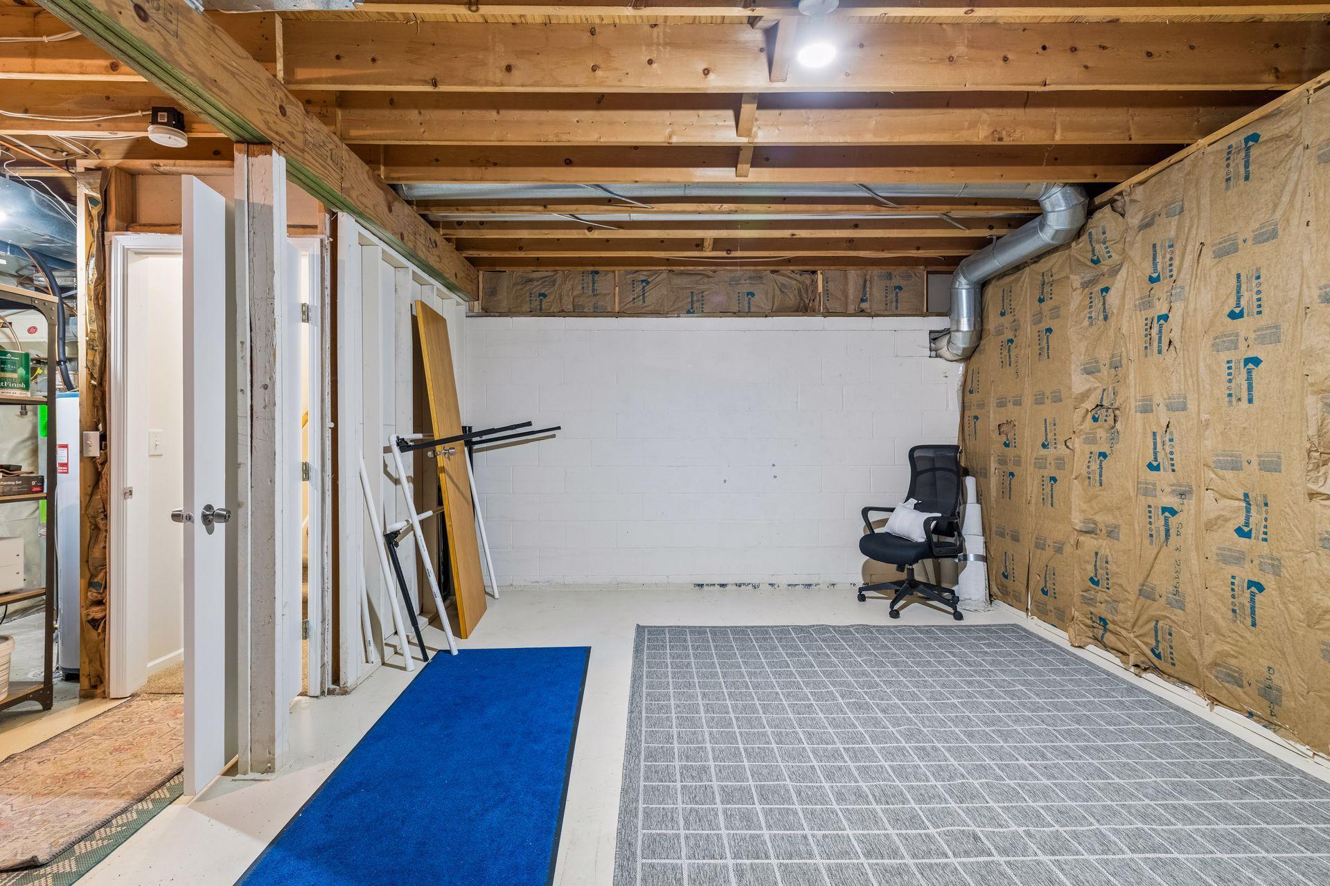 The unfinished lower level features an egress window and offers a blank canvas for future living space. Let your imagination lead the way. See the following photos for inspiring finishing ideas!